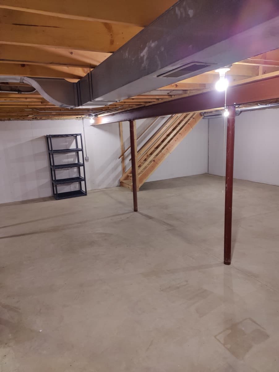 The same unfinished basement cleared after ECOS completed the work